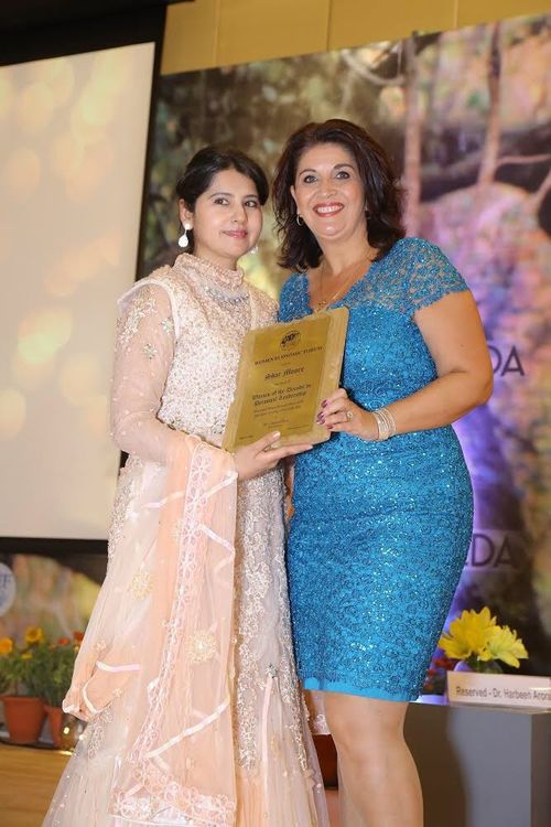 Shar Moore (right) with Dr Harbeen Arora being awarded the Woman of the Decade in Personal Leadership in New Delhi in May this year. Picture: Supplied