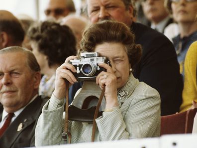 Queen Elizabeth taking photos with a Leica camera