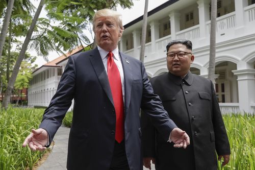 Mr Trump and Kim emerge from their lunch revealing they are going to sign something. Picture: Evan Vucci/AP