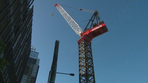 A worker on Brisbane's Cross River Rail project has died after falling up to 10 metres from scaffolding.