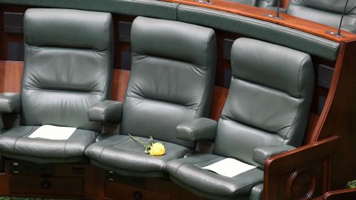 A yellow flower is placed on the seat of Victorian MP Fiona Richardson last Thursday. (AAP)