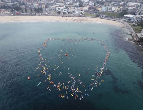 The parents of 12-year-old shark attack victim Nico Antic joined a paddle out in his honour in Bondi.