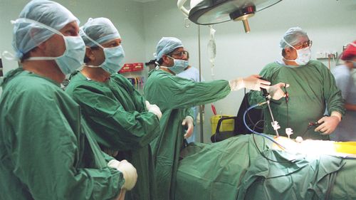 Doctors at the Holroyd Private Hospital in 1997 carry out the mesh repair of a hernia in the groin. 