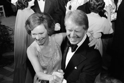 Photograph of President Jimmy Carter and First Lady Rosalynn Carter dancing at a White House Congressional Ball. Photographed by Marion S. Trikosko. Dated 1977. (Photo by: Universal History Archive/Universal Images Group via Getty Images)