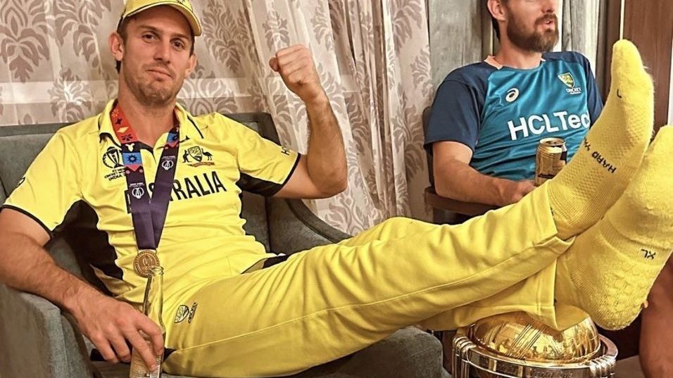 Mitchell Marsh with his feet resting on the World Cup trophy after Australia&#x27;s victory over India.