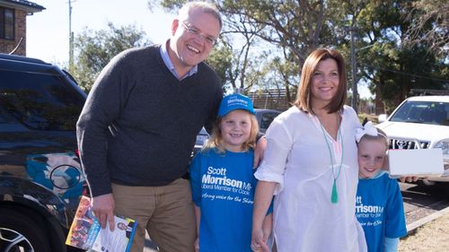 Mr Morrison with his wife Jenny with their children Lily (middle) and Abby (far right) at the 2016 election.