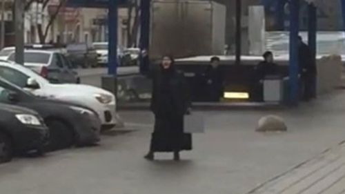 The woman was seen with the severed head outside a Moscow metro station.