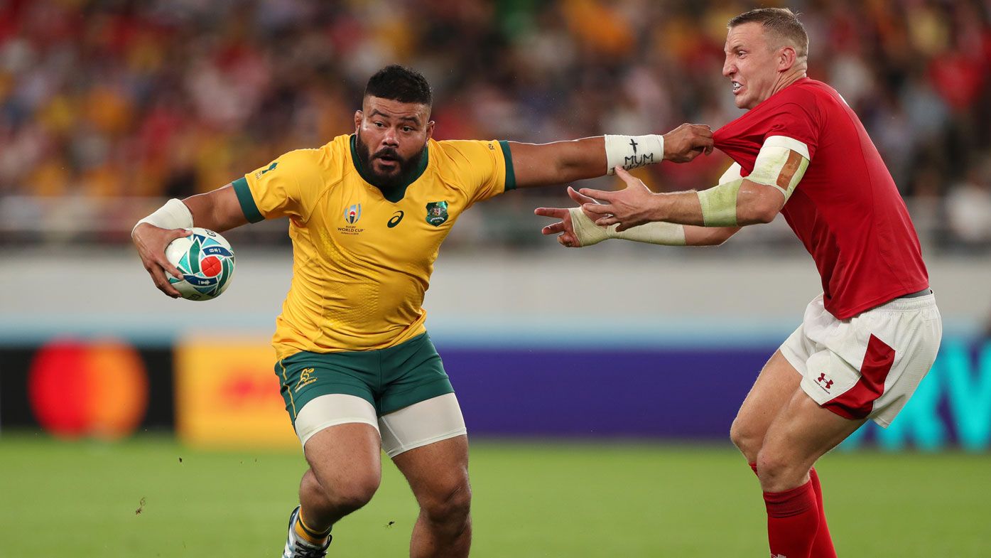 Tolu Latu of Australia holds off Hadleigh Parkes of Wales during the Rugby World Cup 2019