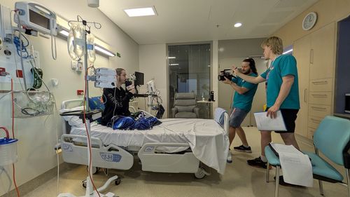 Brandan presents to camera during crab treatment.