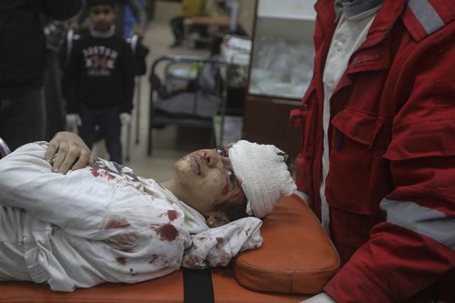 Palestinians wounded in the Israeli bombardment of the Gaza Strip are brought to Al Aqsa hospital in Deir al Balah, Gaza Strip, Monday, March 25, 2024