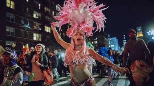 The parade, which is open to anyone wearing a costume, began in 1973 with a puppeteer marching with his family and grew into a televised extravaganza. (AP)