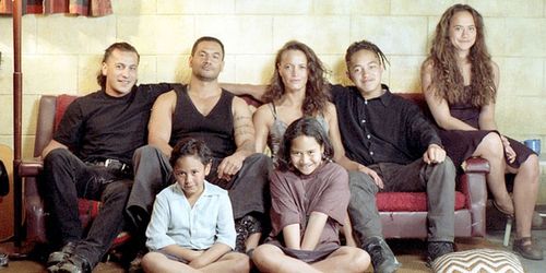 The cast who play the Heke family in the film Once Were Warriors pose together on set in 1994 and (below) at the 20-year reunion in 2014. (Supplied)