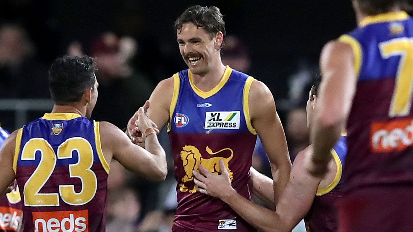 Joe Daniher of the Lions celebrates a goal during the round five AFL match between the Brisbane Lions and the Essendon Bombers at The Gabba on April 17, 2021 in Brisbane, Australia. (Photo by Jono Searle/AFL Photos/via Getty Images )