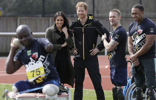 Prince Harry and his fiancee Meghan Markle meet athletes at the UK team trials for the upcoming Invictus Games Sydney 2018. (AAP)