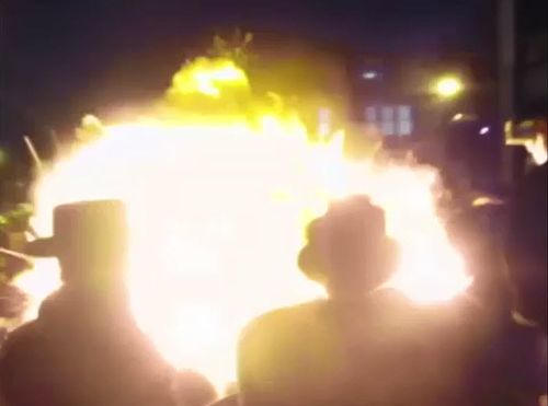 A crowd of hundreds were showered in balls of  flame as the bonfire erupted during Jewish Lag BaOmer celebrations in Stamford Hill. Picture: Supplied.