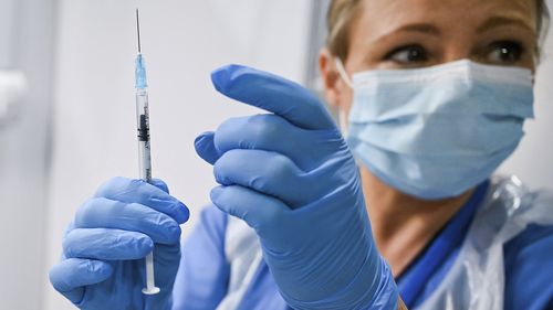 Grace Thomson (left) receives the first of two Pfizer/BioNTech Covid-19 vaccine jabs, administered Paula McMahon, at the NHS Louisa Jordan Hospital in Glasgow, on the first day of the largest immunisation programme in the UK's history. Care home workers, NHS staff and people aged 80 and over began receiving the jab this morning. PA Photo. Picture date: Tuesday December 8, 2020. See PA story HEALTH Coronavirus. Photo credit should read: Jeff Mitchell/PA Wire