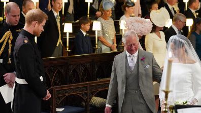 Prince Charles escorts Meghan Markle to the altar at her wedding to Prince Harry.