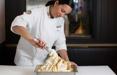 Anna Temellini, product innovation specialist for Gelatissimo. Woman scooping gelato