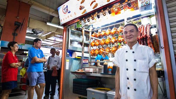 Singapore-based chef Chan Hon Meng pictured out the front of his Michelin star street stall Honk Kong Soya Sauce Chicken Rice & Noodles. Image: Supplied