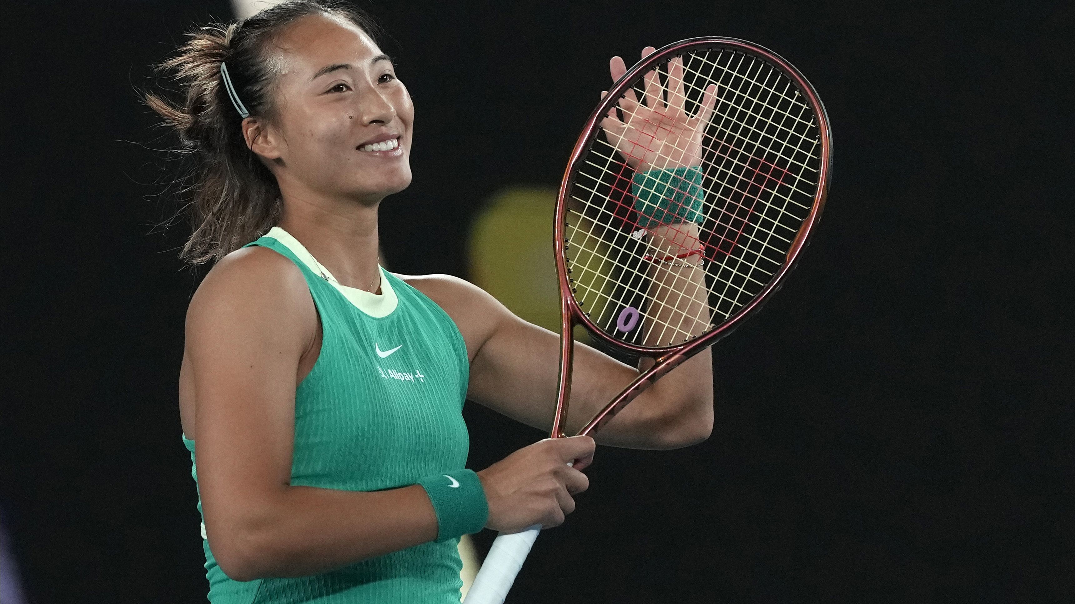 Zheng Qinwen of China reacts after defeating Oceane Dodin of France in their fourth round match at the Australian Open.