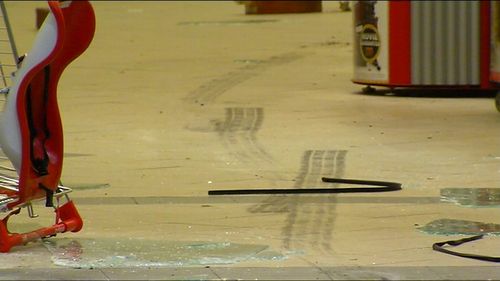 Tyre marks inside the shopping centre.