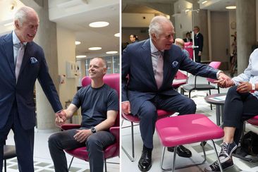 King holds hands of cancer patients during poignant return to public duties after diagnosis