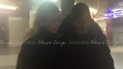 The fugitive was spotted with his new girlfriend outside a cinema. (NewsCorp)