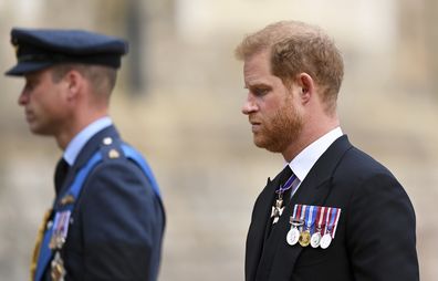 Britain's Prince William and Prince Harry join the Procession following the State Hearse carrying the coffin of Queen Elizabeth II towards St George's Chapel, Windsor, Monday Sept. 19, 2022. 