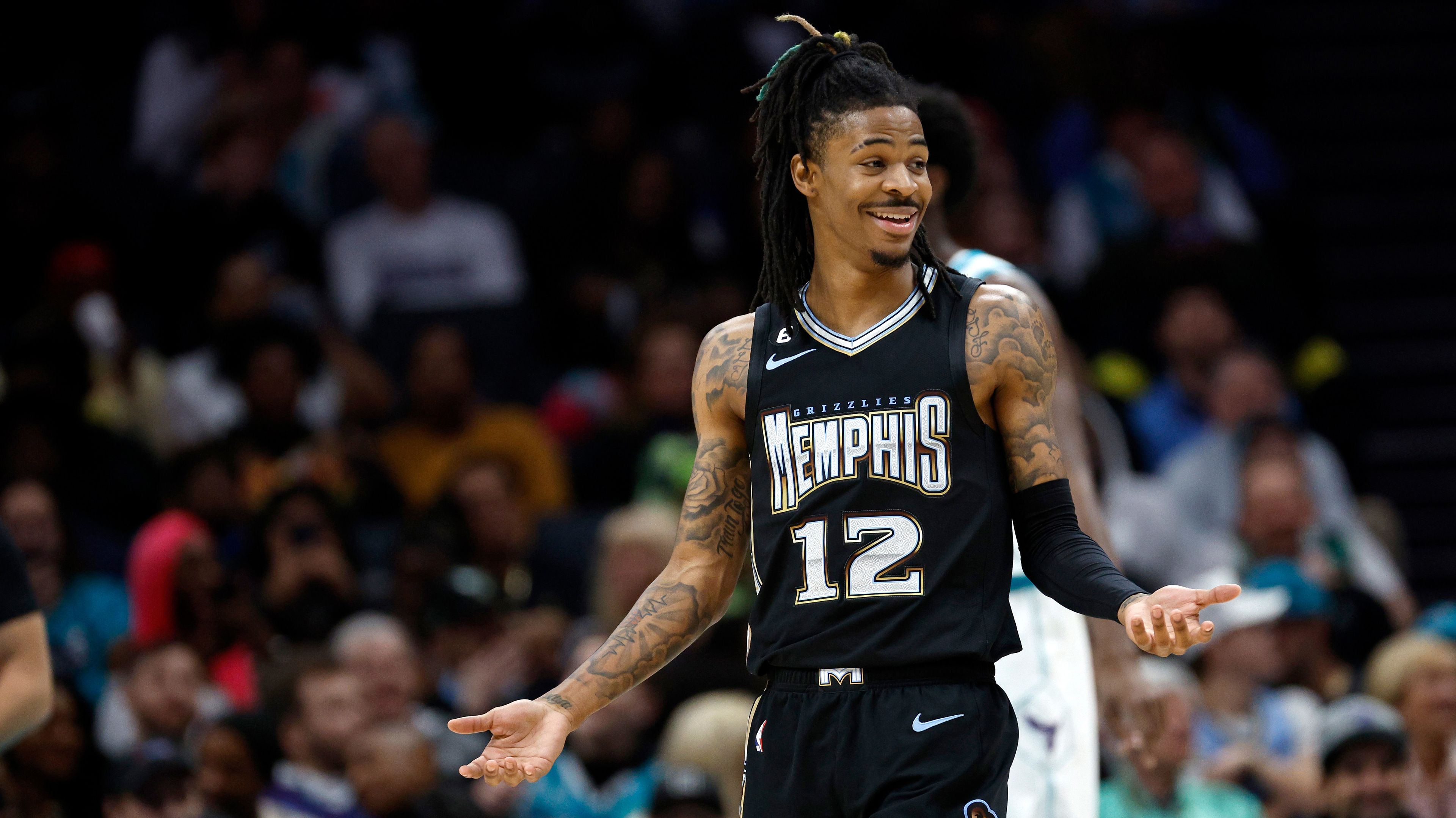 Ja Morant #12 of the Memphis Grizzlies reacts following a basket during the first quarter of the game against the Charlotte Hornets at Spectrum Center on January 04, 2023 in Charlotte, North Carolina. (Photo by Jared C. Tilton/Getty Images)
