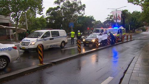 The car was spotted by some eagle-eyed police officers, who stopped to help before paramedics could get to the scene. (9NEWS)