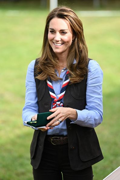 Duchess of Cambridge reacts as she receives the Silver Wolf Award medal during her visit to a Scout Group in Northolt, northwest London where she joined Cub and Beaver Scouts in outdoor activities on September 29, 2020 in London, England