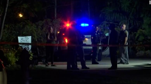 Deputies outside Naples Zoo in Florida after they say a tiger attacked a man who had entered an unauthorised area.