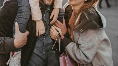 Couple walking with child