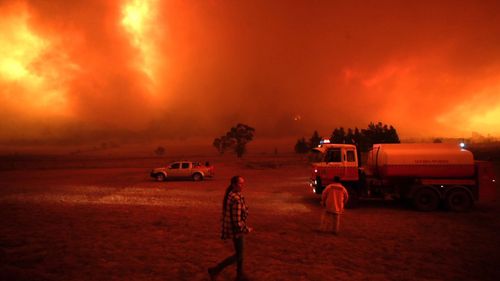 Bumbalong residents getting ready to defend their home from a bushfire south of Canberra