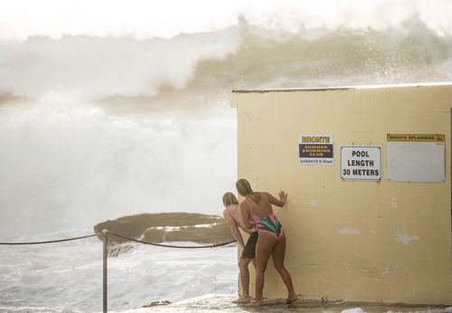 Brave beachgoers daring enough to face the strong swell were faced with offshore waves of up to nine metres in height (AAP).