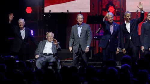 Former Presidents from right, Barack Obama, Bill Clinton, George W. Bush, George H.W. Bush and Jimmy Carter gather on stage at the opening of a hurricanes relief concert in College Station, Texas. (AP)
