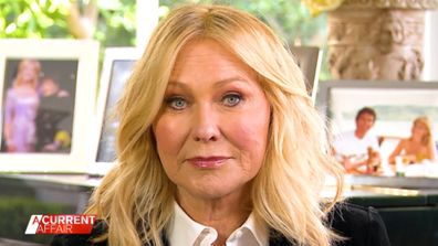 TV presenter Kerri-Ann Kennerley says she's suing the government over the lack of help she got for her late husband.