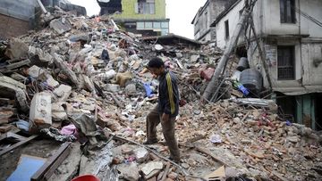 <p>The death toll from the Nepal earthquake has now exceeded 3600, as emergency services and aid workers battle to reach remote areas outside Kathmandu where they expect the toll will rise sharply.</p><p>

A man surveys the remains of a building in Kathmandu on Sunday, a day after the quake struck. (AAP) </p><p>
Click through for images from the scene. </p><p></p>