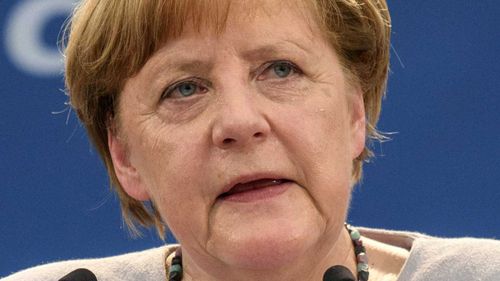 Germany votes, history beckons for Merkel