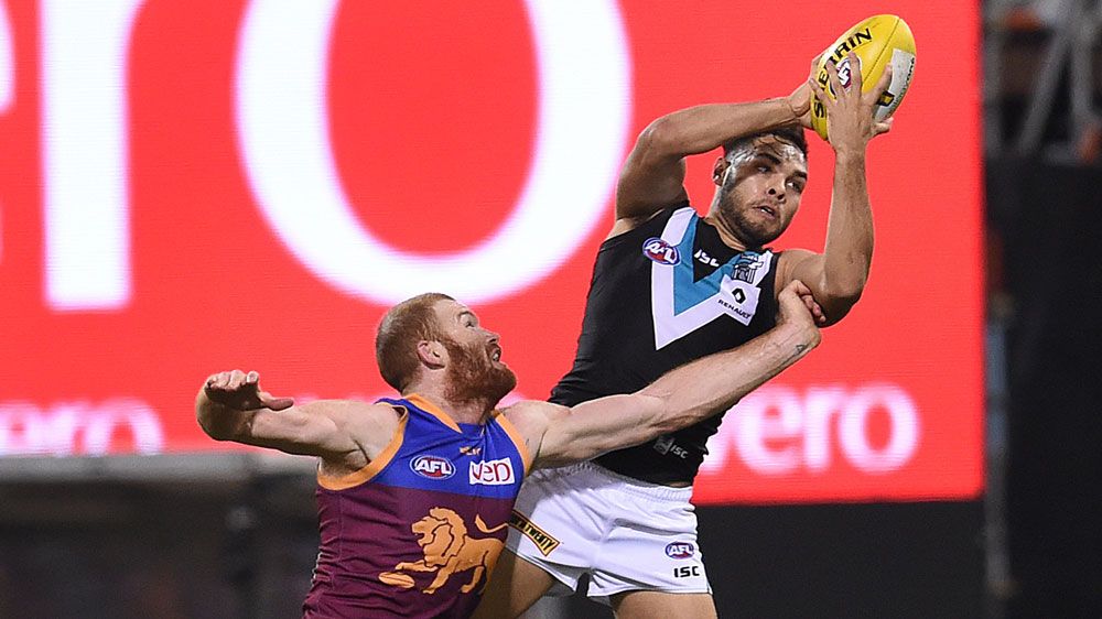 Port Adelaide's Jarman Impey takes a mark (AAP)