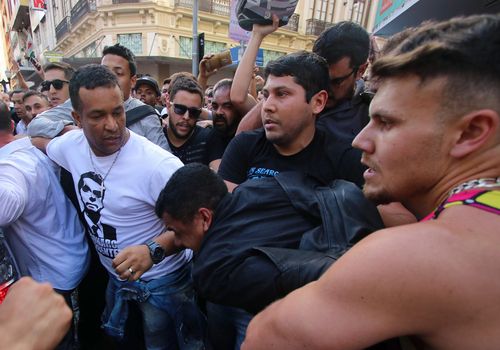 Supporters attack the man who plunged the knife into Bolsonaro.