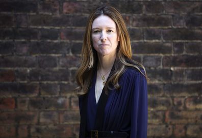 Clare Waight Keller, who designed Meghan Markle's wedding dress, poses for a portrait at Kensington Palace in London. (Hannah McKay/PA Wire)