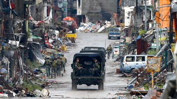 Troops patrol the decimated streets of Marawi city in southern Philippines in 2017 after almost five months of the siege by pro-Islamic State group militants.