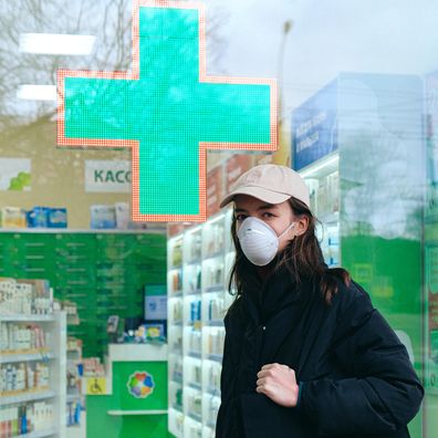 Woman outside pharmacy