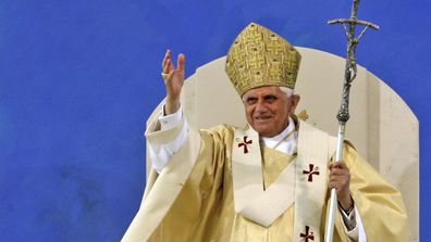 Pope Benedict XVI waves to pilgrims at the end of a papal Mass at the Islinger field in Regensburg, southern Germany, on September 12, 2006.