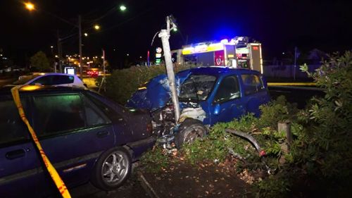 Woman suffers only minor injuries after crashing into traffic light and parked car in Sydney