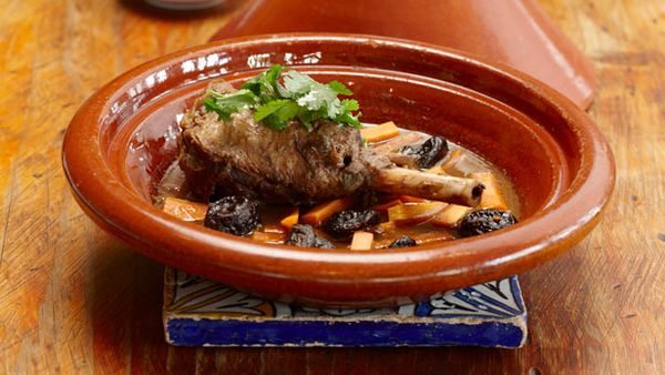 Lamb shank tagine with prunes and carrots, served with steamed couscous