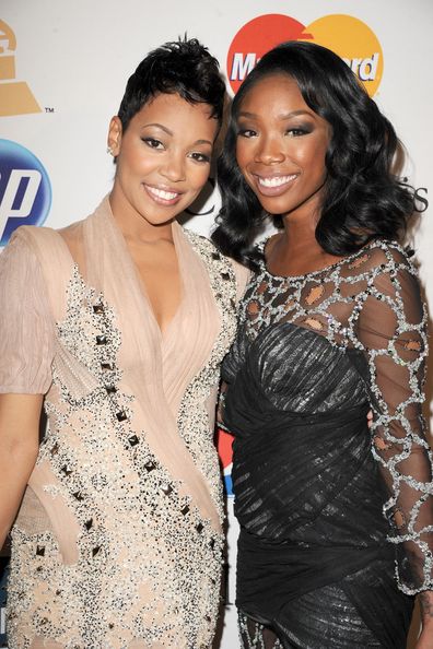 Brandi and Monica arrive at the 2011 Pre-GRAMMY Gala and Salute To Industry Icons Honoring David Geffen at The Beverly Hilton Hotel on February 12, 2011 in Beverly Hills, California.