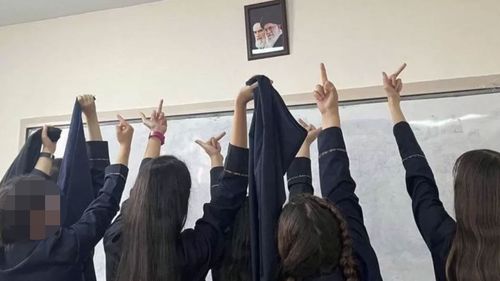 Iran schoolgirls take off their hijabs in protest.