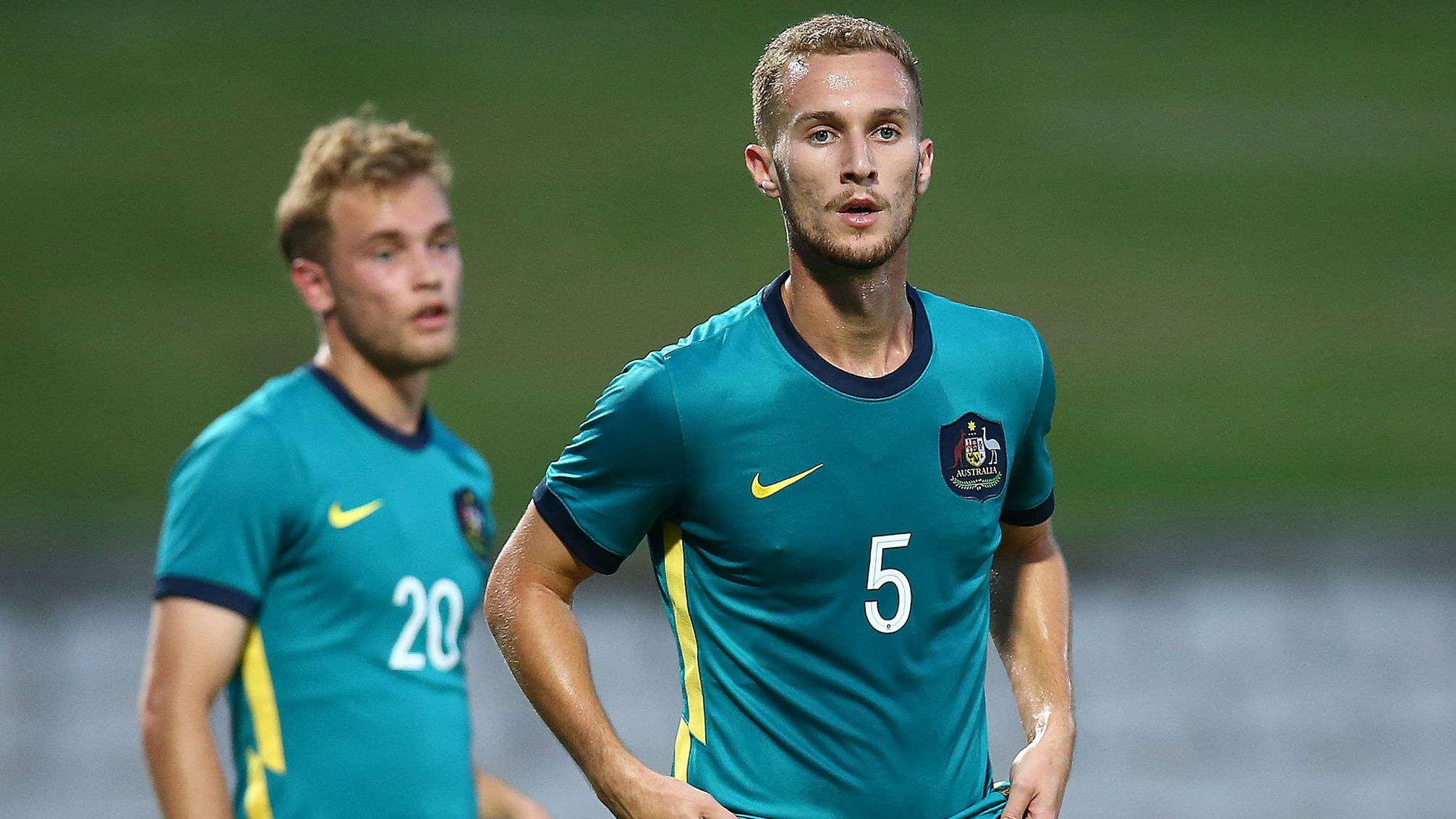 Tass Mourdoukoutas of the Olyroos looks on.